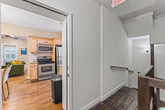 interior space featuring ceiling fan and wood-type flooring