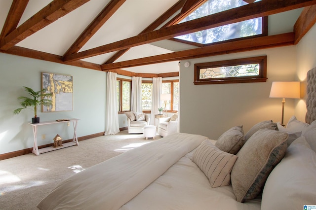 carpeted bedroom featuring beam ceiling, high vaulted ceiling, and multiple windows