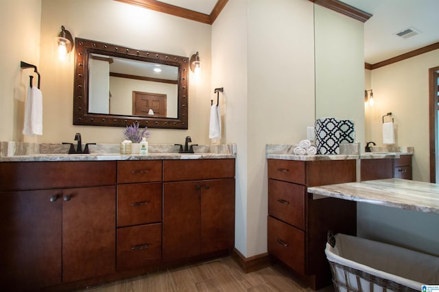 bathroom featuring vanity, wood-type flooring, and crown molding