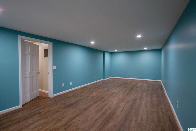 empty room with hardwood / wood-style flooring