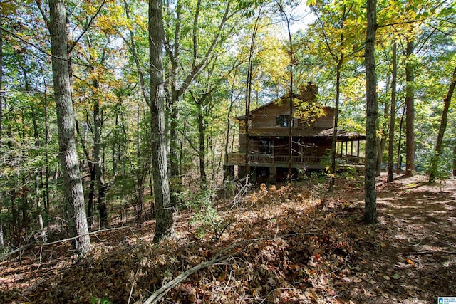 back of property with a wooden deck