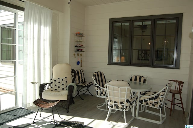 exterior space featuring hardwood / wood-style flooring and wooden walls