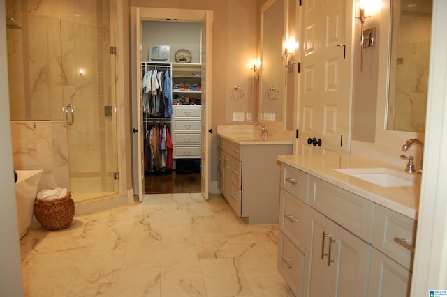 bathroom featuring vanity and a shower with door