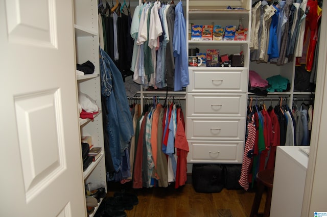 walk in closet featuring dark wood-type flooring