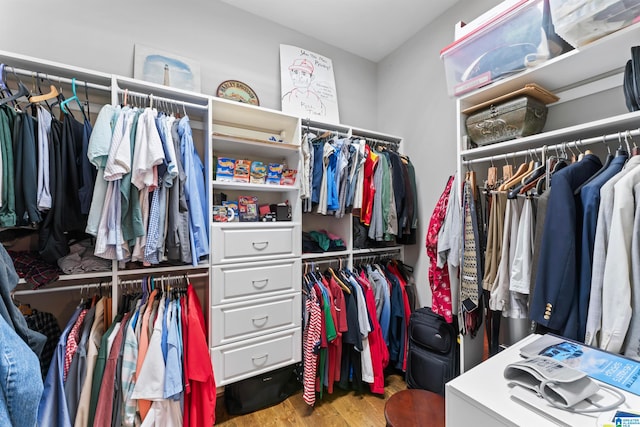 walk in closet featuring light hardwood / wood-style floors