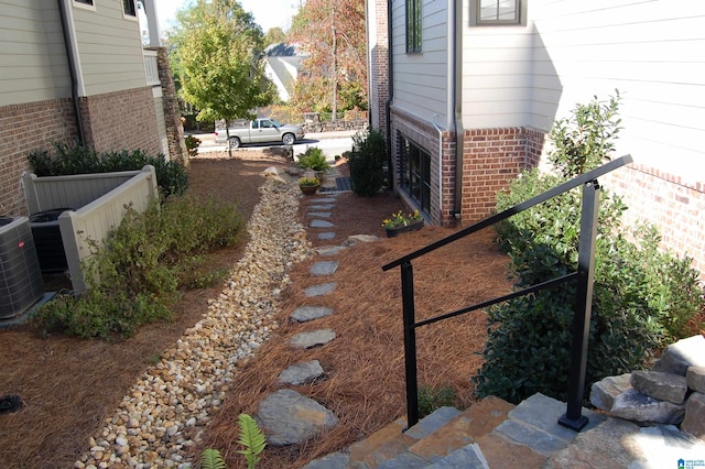 view of yard with central AC