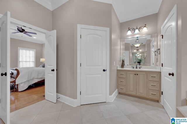 bathroom with hardwood / wood-style floors, vanity, ceiling fan, and crown molding