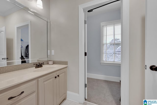 bathroom featuring tasteful backsplash and vanity