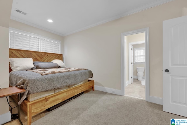 bedroom featuring ensuite bath, light carpet, and crown molding