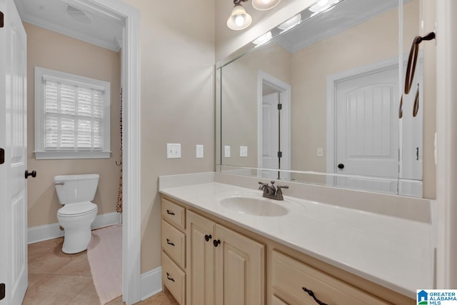 bathroom featuring vanity, tile patterned floors, and toilet