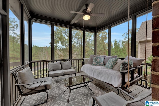 sunroom / solarium with a wealth of natural light and ceiling fan