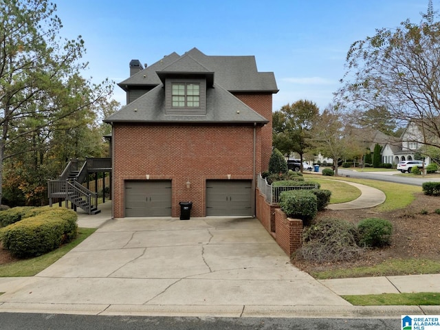 view of side of home with a garage