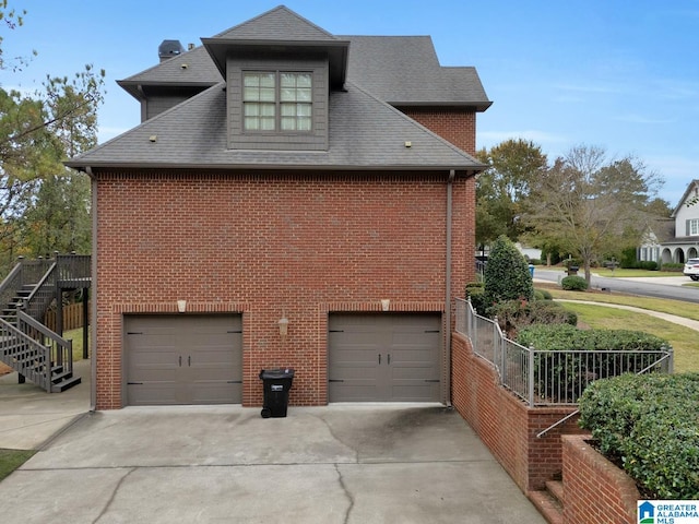 view of side of property with a garage