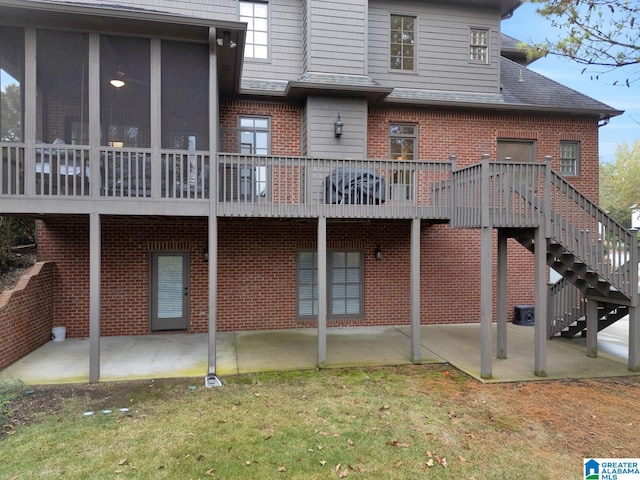 back of house with cooling unit, a lawn, a patio, and a deck