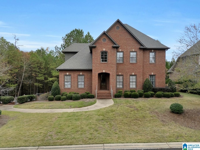 colonial inspired home with a front yard