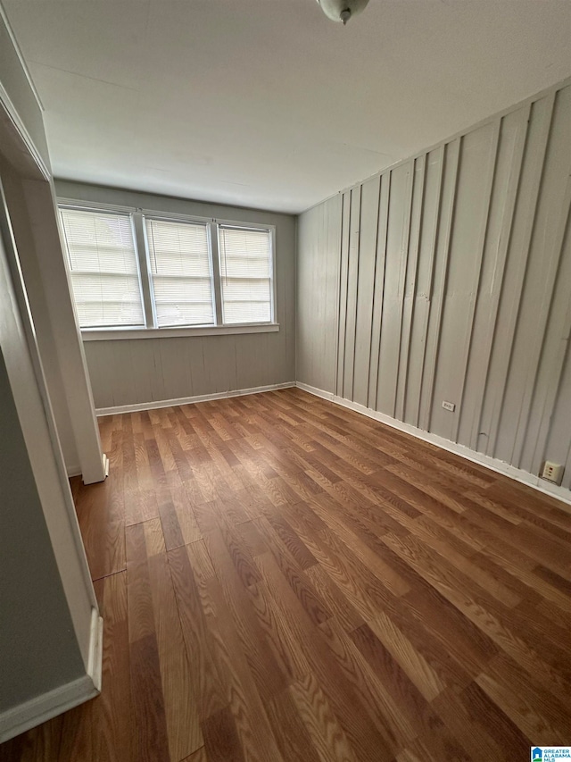 spare room featuring hardwood / wood-style floors