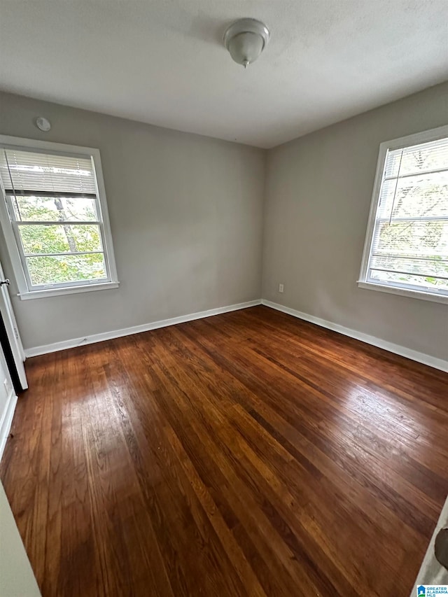 empty room featuring dark hardwood / wood-style floors