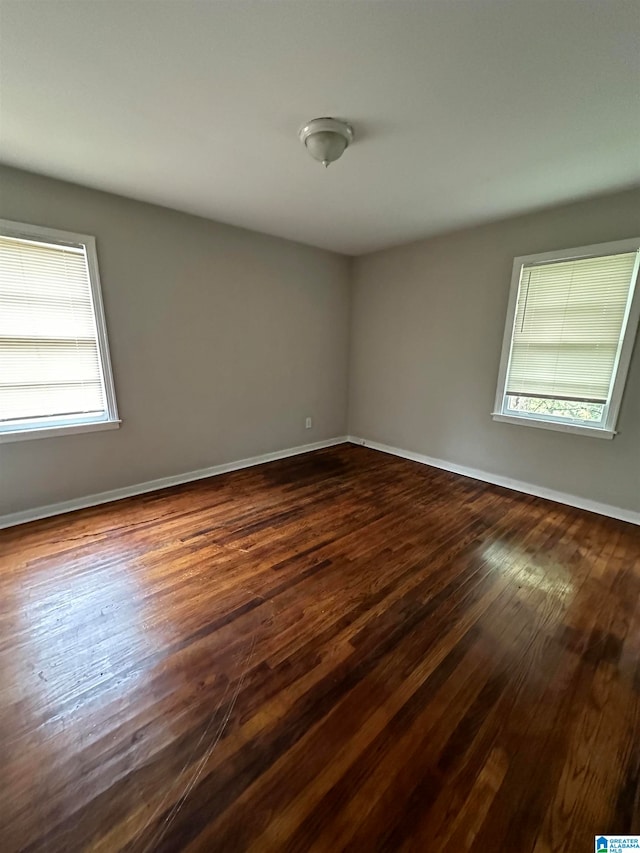 spare room featuring dark hardwood / wood-style floors