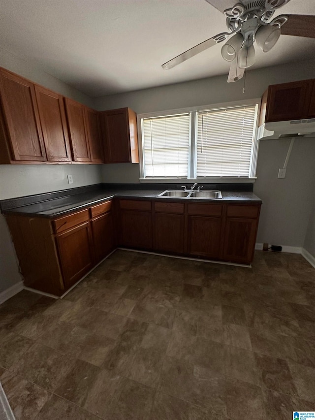 kitchen with ceiling fan and sink