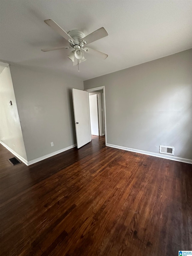 unfurnished room featuring dark hardwood / wood-style floors and ceiling fan