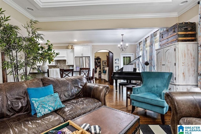 110 Sterling Lakes Dr, Helena, AL 35080 - living room featuring arched walkways, wood finished floors, a chandelier, and ornamental molding