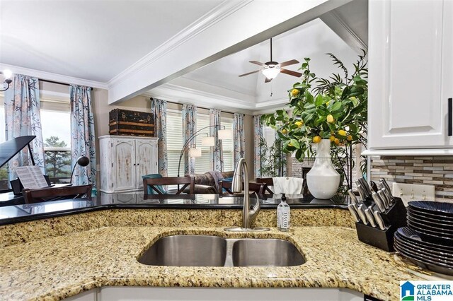 110 Sterling Lakes Dr, Helena, AL 35080 - kitchen featuring a sink, light stone countertops, tasteful backsplash, a ceiling fan, and white cabinets
