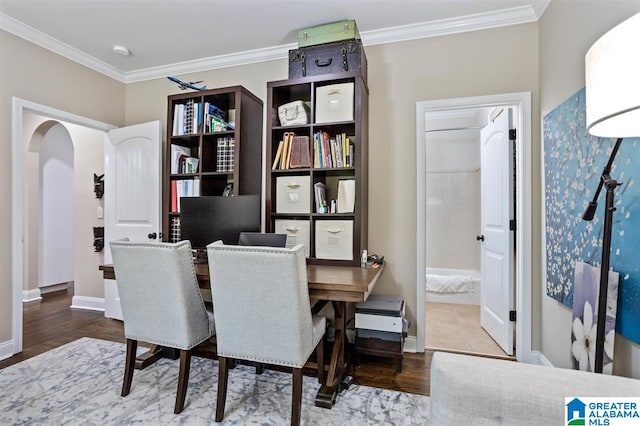 dining area featuring hardwood / wood-style floors and crown molding