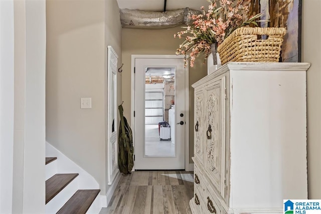 doorway with light hardwood / wood-style floors