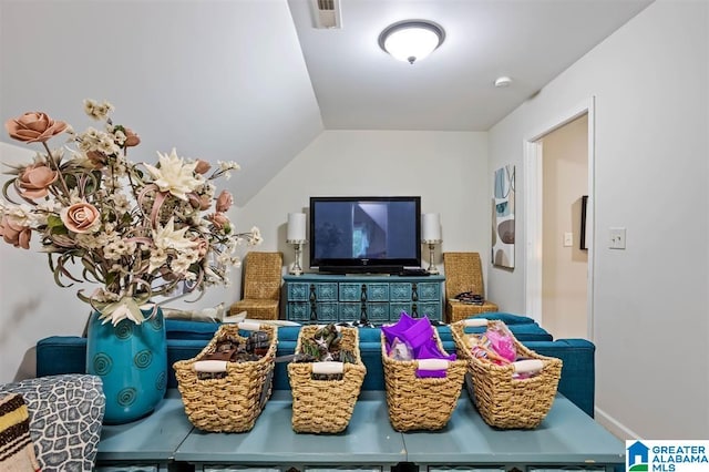 living room with lofted ceiling