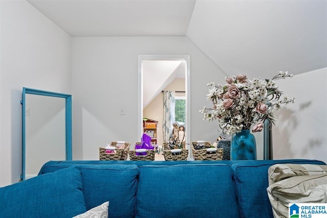 living room featuring lofted ceiling