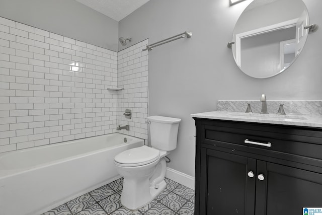 full bathroom with vanity, tile patterned flooring, tiled shower / bath combo, toilet, and a textured ceiling