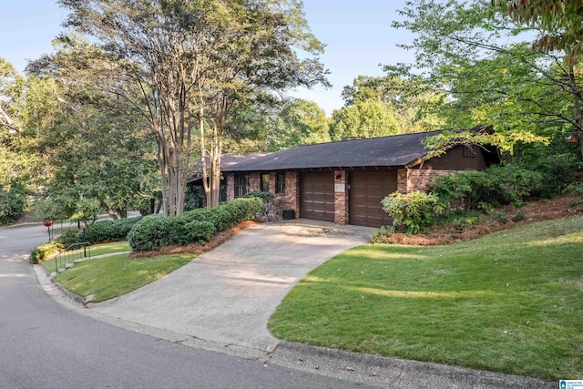 view of front of home with a garage and a front yard