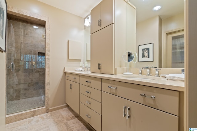 bathroom featuring vanity and a shower with door