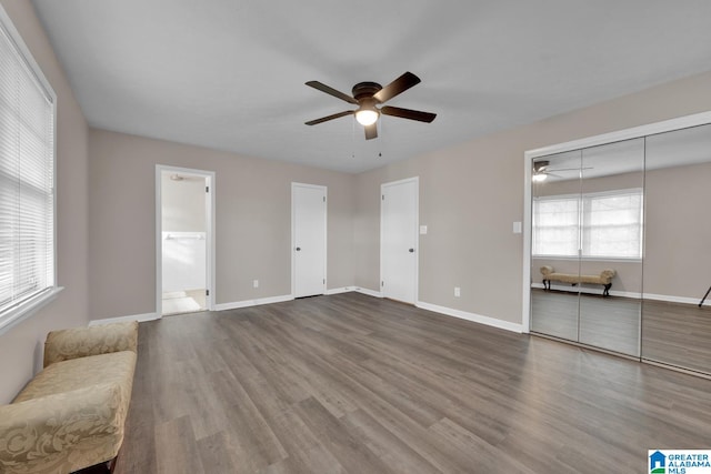 unfurnished room with wood-type flooring and ceiling fan