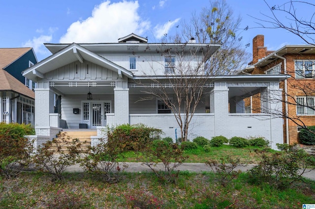1031 S 26th St, Birmingham, AL 35205 - view of front of property featuring brick siding, board and batten siding, and a porch