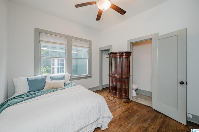 bedroom with dark hardwood / wood-style flooring, ceiling fan, and ensuite bathroom