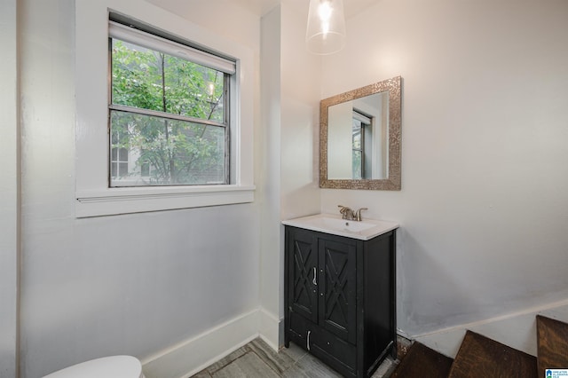 bathroom with vanity and toilet