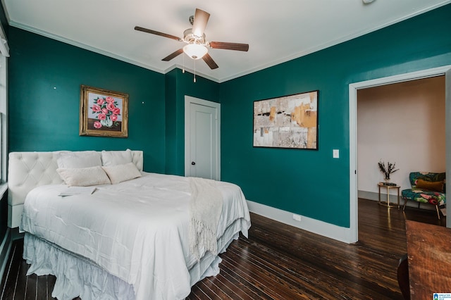 bedroom with ornamental molding, dark wood-type flooring, and ceiling fan