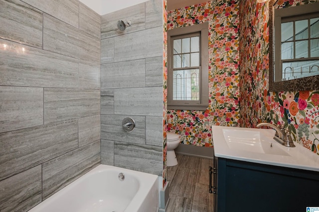 1031 S 26th St, Birmingham, AL 35205 - full bathroom with wallpapered walls, baseboards, toilet,  shower combination, and vanity