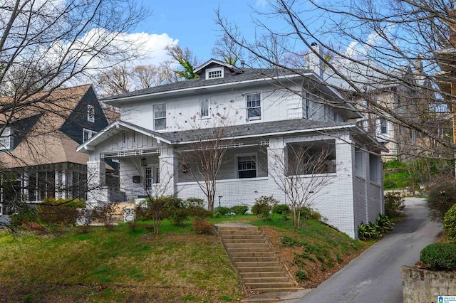 1031 S 26th St, Birmingham, AL 35205 - american foursquare style home with stairway, board and batten siding, and brick siding
