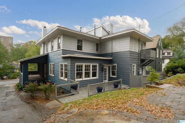 view of side of home with a balcony