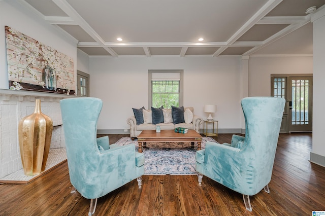 living room featuring coffered ceiling, wood-type flooring, and beam ceiling