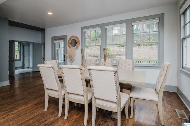 dining space with dark wood-type flooring