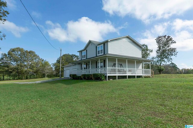 exterior space with a garage, a porch, and a yard