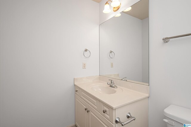 bathroom with vanity and toilet