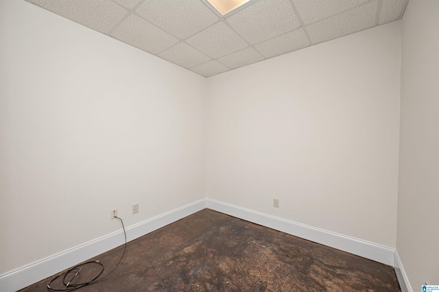 spare room with a drop ceiling