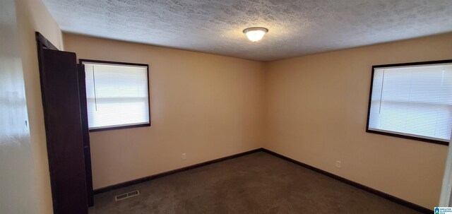 401 Park St E, Sylacauga, AL 35150 - unfurnished room with carpet flooring, baseboards, and a textured ceiling