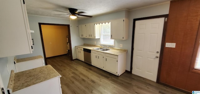 kitchen featuring sink, ceiling fan, stainless steel dishwasher, dark hardwood / wood-style floors, and white cabinetry