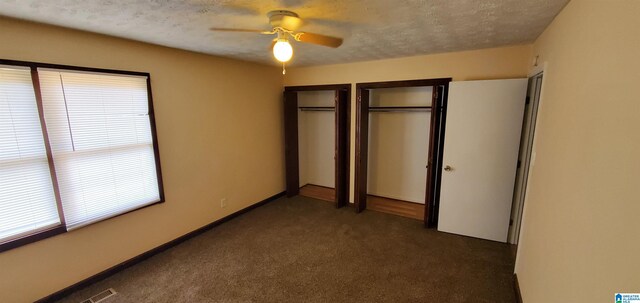 401 Park St E, Sylacauga, AL 35150 - unfurnished bedroom with multiple closets, carpet flooring, a textured ceiling, and ceiling fan