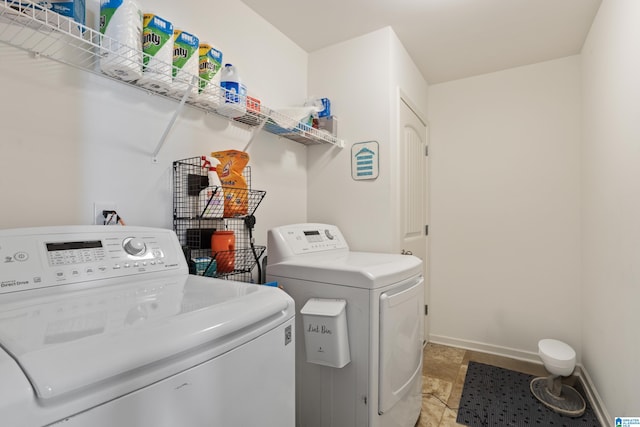 washroom with independent washer and dryer